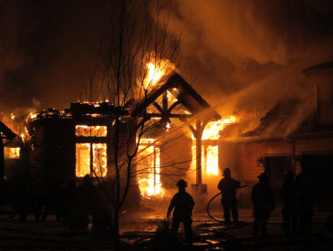 Wooden house on fire